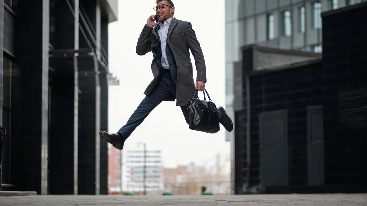 Person hurrying to finish an online loan application on a phone before the afternoon funding cutoff