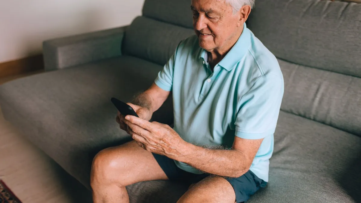 Phone on an accessible kitchen counter showing an e-transfer from ODSP payday loans