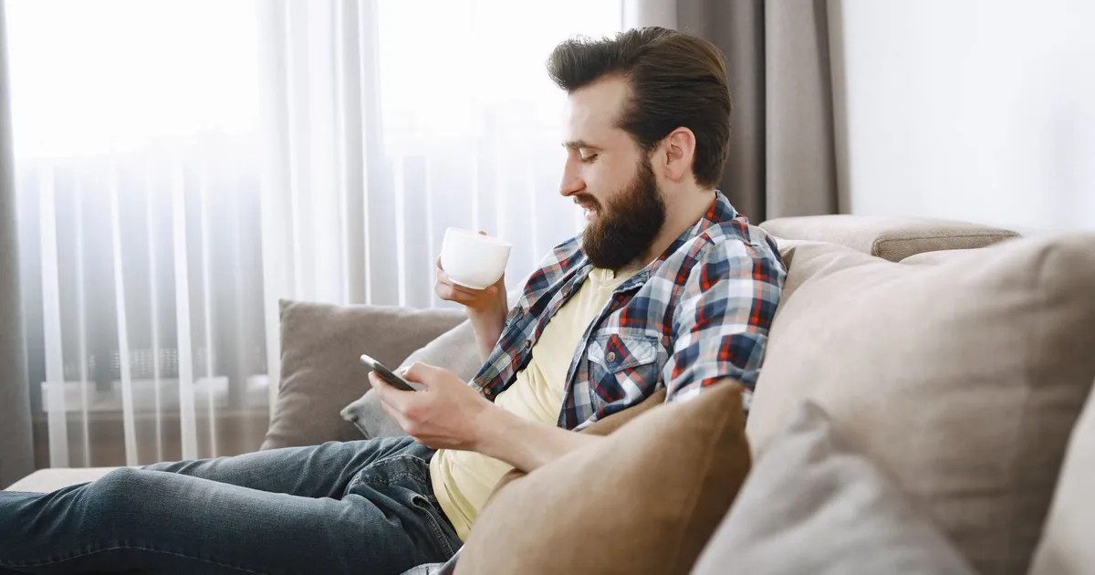 Saturday morning coffee and a phone showing an approved application for weekend payday loans no credit check